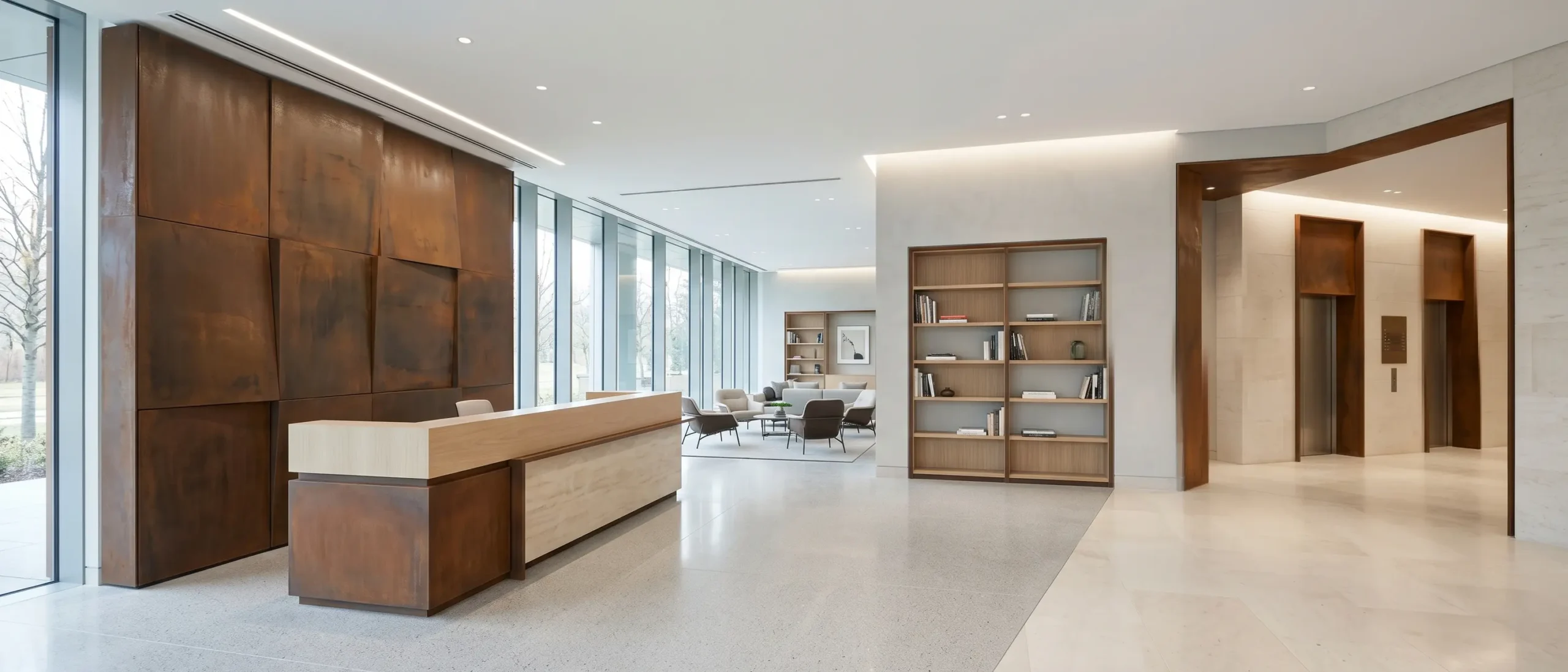 Bright modern commercial office lobby with Corten steel feature wall, reception desk, designer bookcase, elevator zone, pale stone flooring, and architectural finishes.