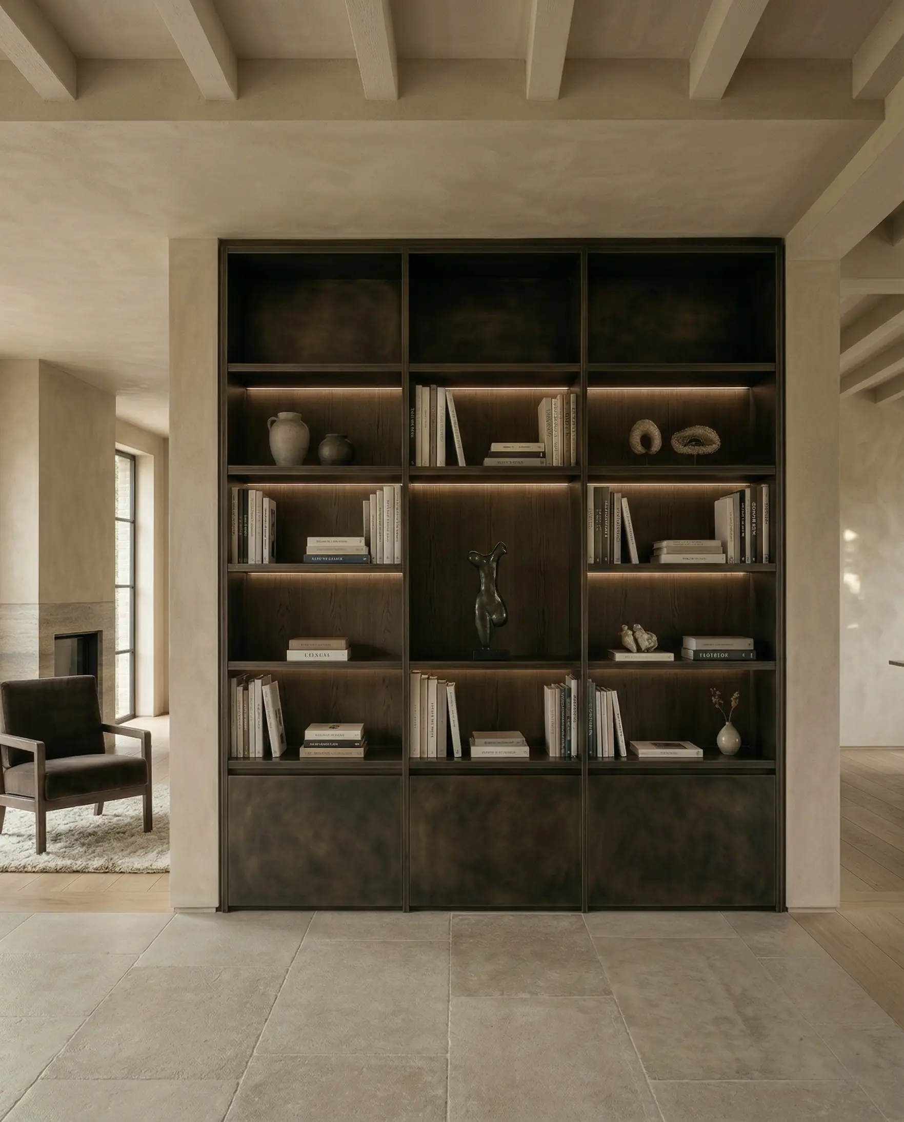 Designed metal bookcase with dark metal finish and integrated shelving in an architectural interior