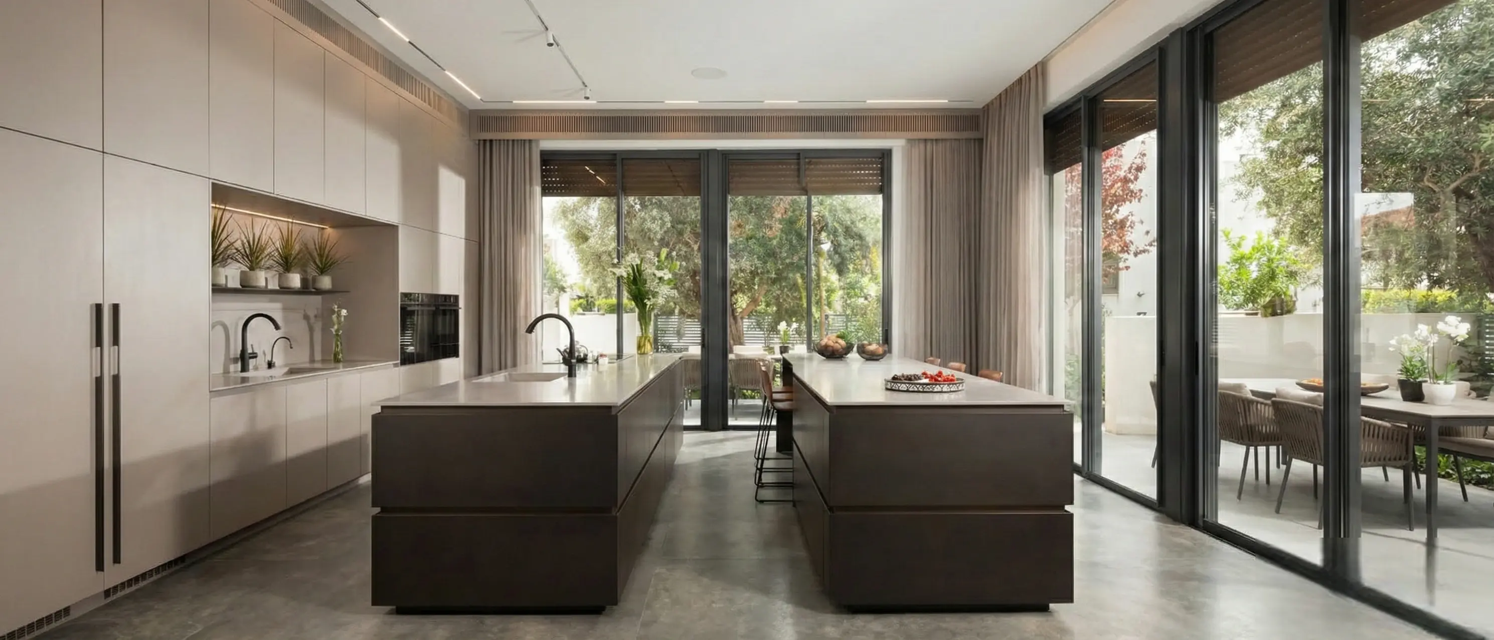 Contemporary kitchen with MetaliQ Bronze liquid metal coated fronts in a deep blackened finish under soft daylight.
